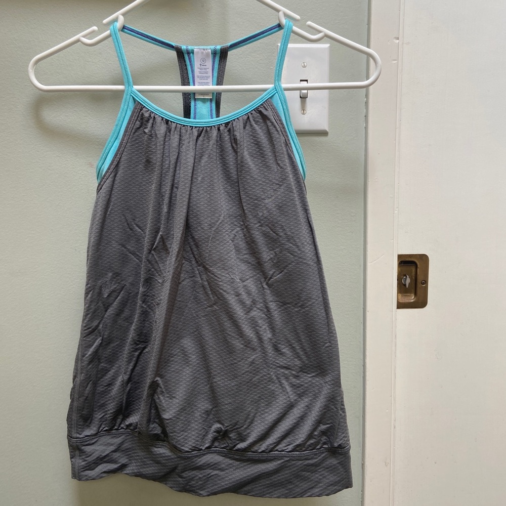 Grey Ivivva girls too size 12 with a blue built in shelf bra